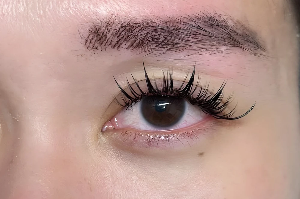 Shaped brow and a wispy lash set, close-up